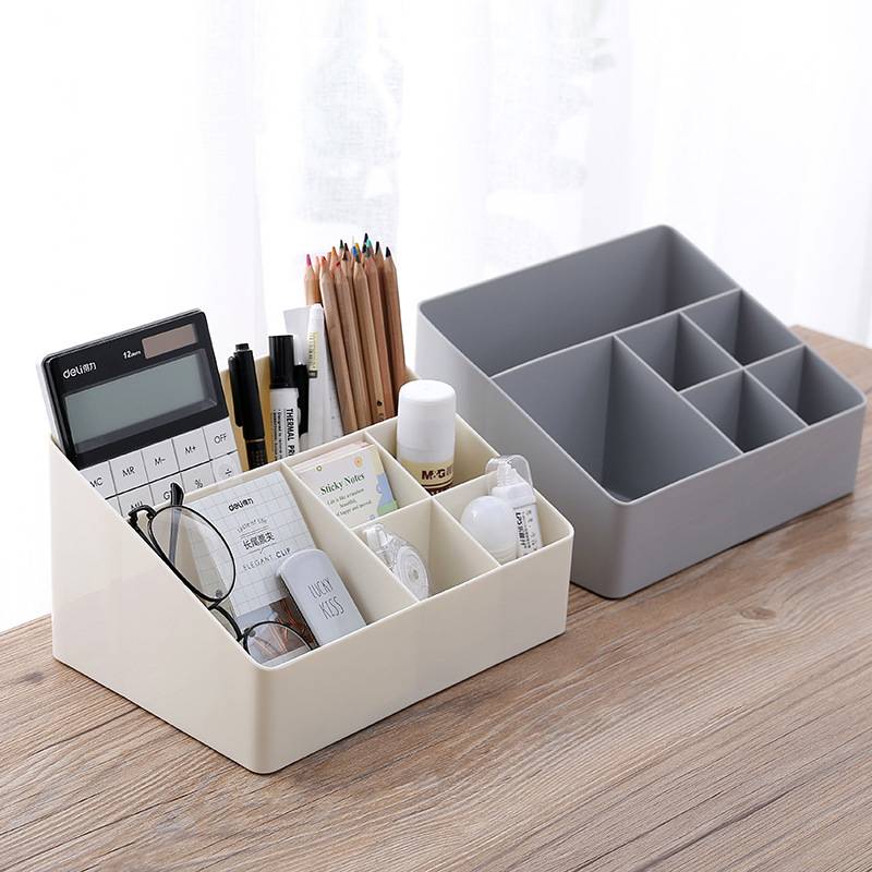 Storage box with large and small grids
